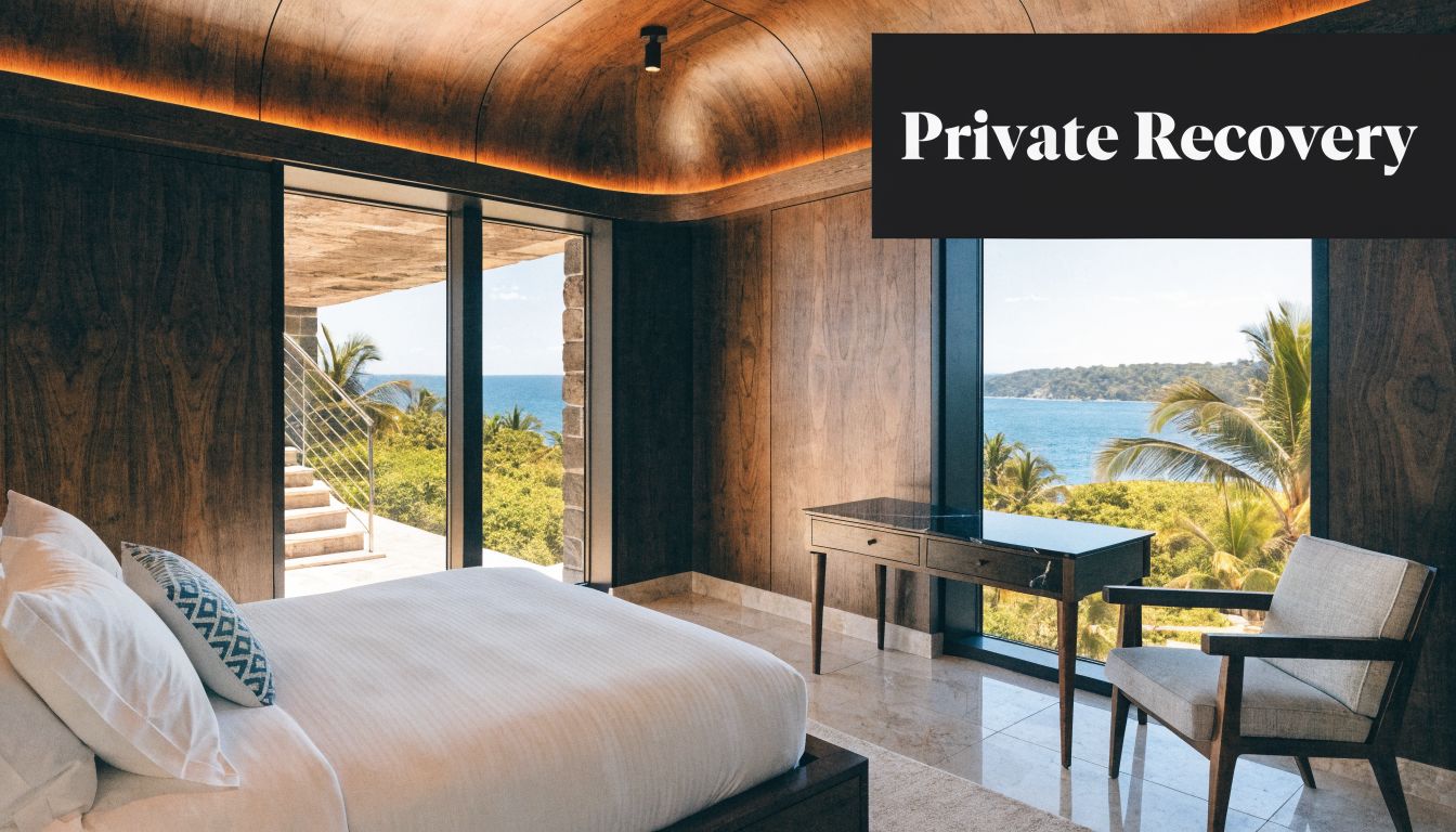 A luxurious bedroom with a king bed and ocean view at a private recovery retreat center.