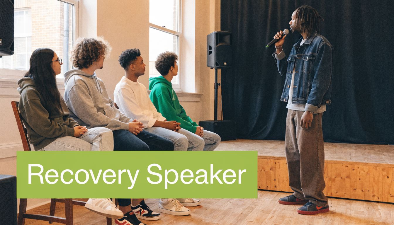 A man speaks into a microphone at a recovery support group meeting in Orange County.